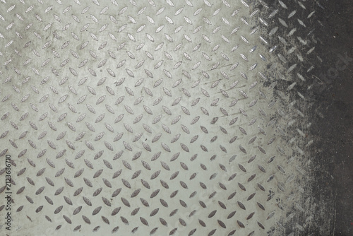 Cuadro en lienzo The background shows an old, worn, and peeling diamond-shaped anti-slip steel plate