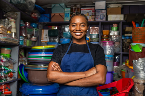 Obraz na plátne Smiling african woman entrepreneur standing confidently in her small shop, SME