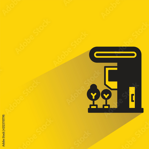 modern house building with shadow on yellow background