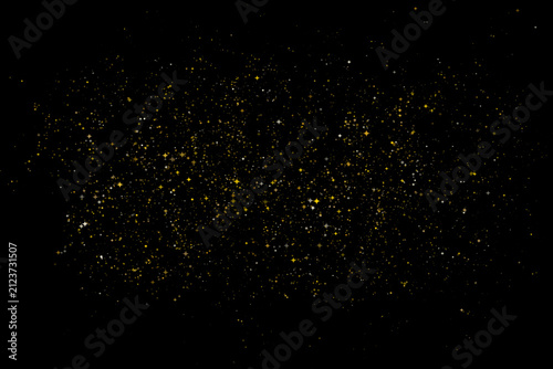 Картината върху платно Golden glitter dust particles on black background