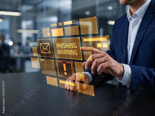 Corporate security expert manages cyber threat alert on futuristic touch screen display representing phishing warning notification for online safety.
