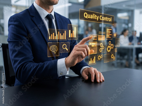 Manager touching interactive quality control interface in professional workspace displaying manufacturing monitoring and industrial automation systems.