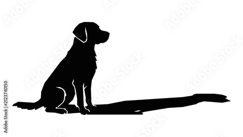Loyal dog sits patiently, casting a long shadow in the bright light, waiting for its owner.