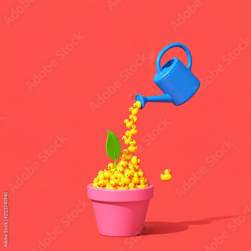 Rubber ducks growing in flowerpot with watering can
