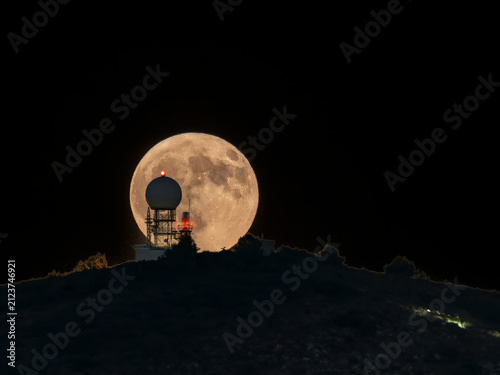 Moonrise behind the weather station in Cullera (Valencia, Spain)