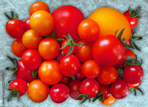 Fresh ripe tomatoes of mixed size and color for a salad in close up