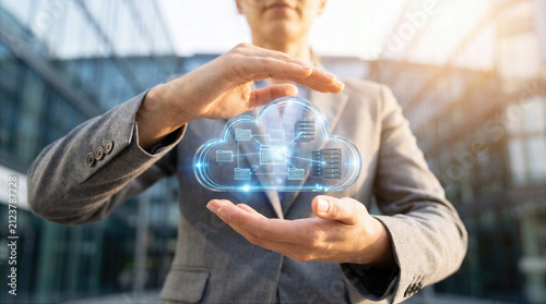 Cloud computing and data storage technology in the hands a business professional. Digital network connection with server and database infrastructure for online information transfer, backup, security