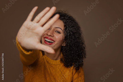 Adult woman making stop gesture with her hand