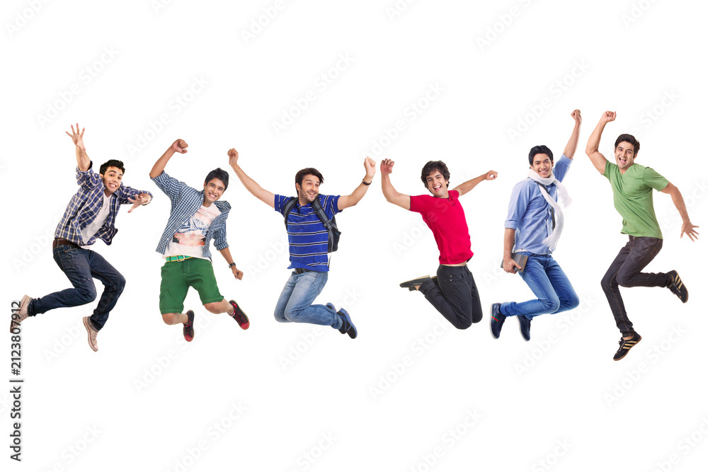 Obraz premium A group of young boys in casual clothing jumping with various body gestures 
