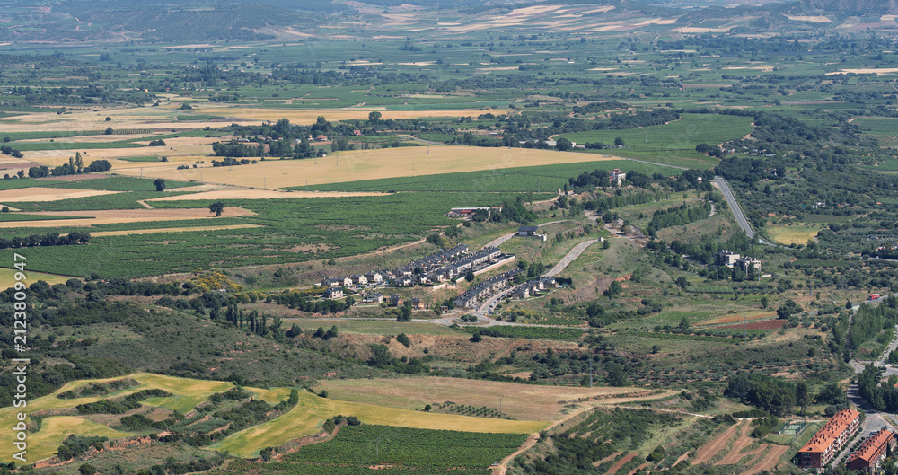 Obraz premium Suburban Homes Among Patchwork Fields in La Rioja