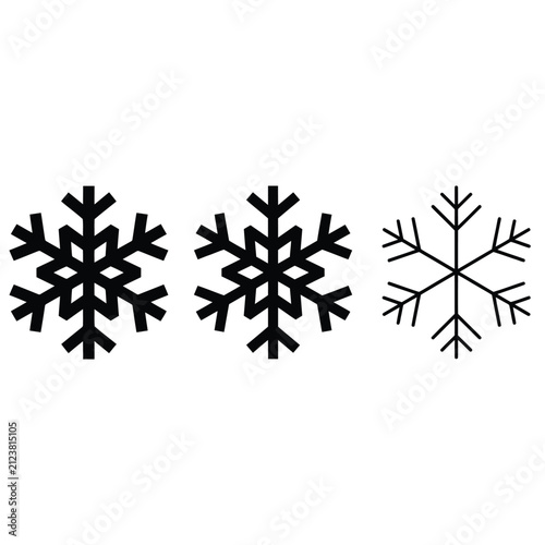 白い背景に分離された 3 つの異なる黒い雪の結晶