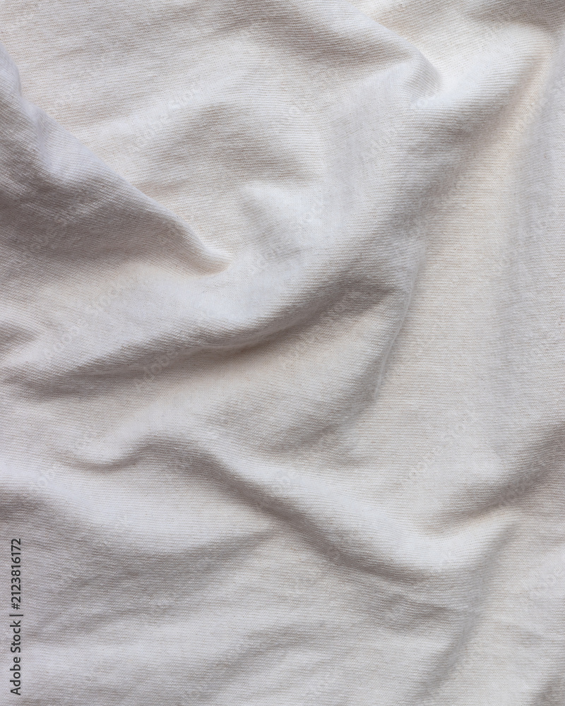 Fototapeta premium Soft white fabric texture with gentle folds, versatile minimalist background
