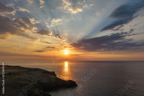 Stunning peaceful Summer sunset landscape over Trevose Head in Cornwall England