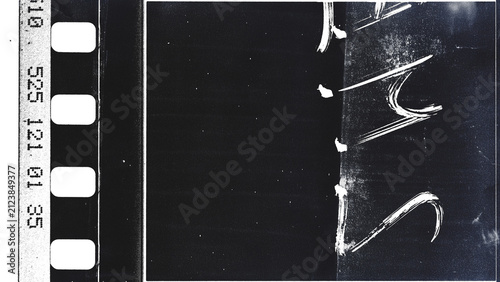 Fotografía Vintage black and white film strip frame with sprocket holes and timecode numbers