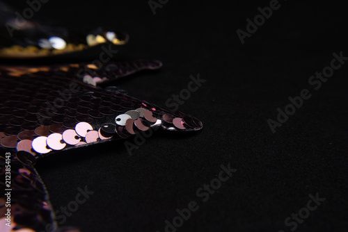  a crown with shiny confetti on a black background