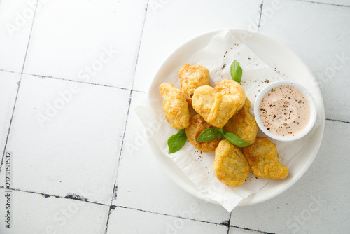 Homemade chicken nuggets with sauce