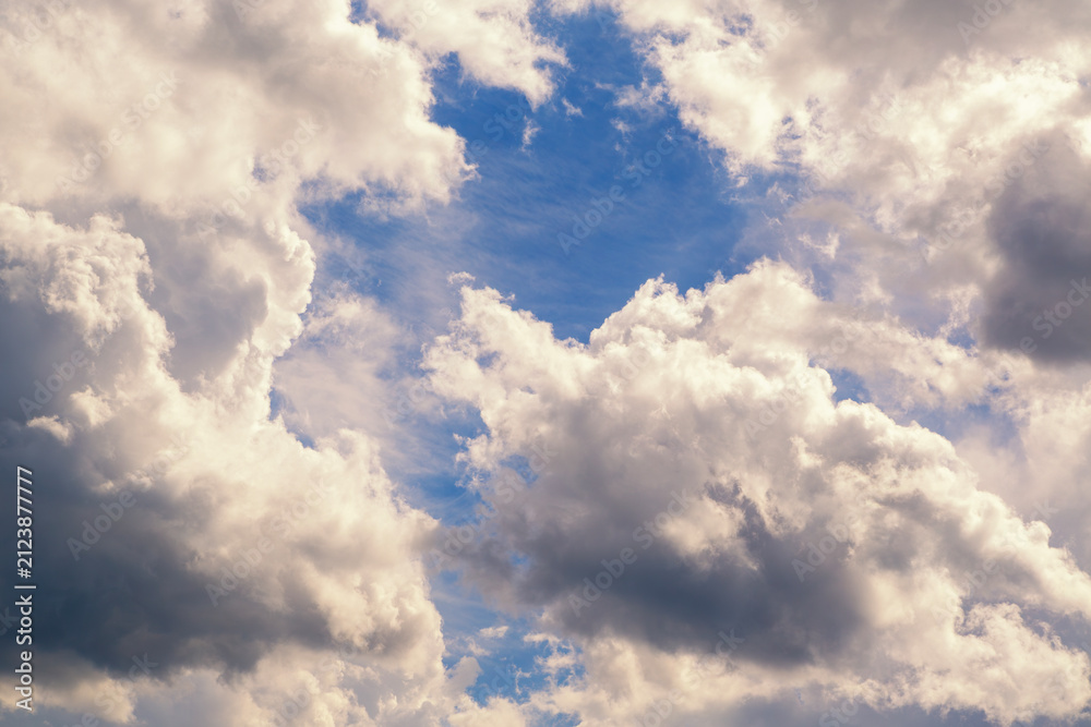 Fototapeta premium Dramatic Blue Sky With Large Cumulus Clouds, Sunlit Highlights and Atmospheric Texture