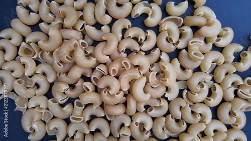 Slow Motion Pasta Food Preparation Clip , top down view of elbow pasta