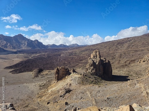 Volcanic desert landscape with dramatic rock formations