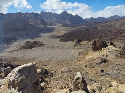 Volcanic crater landscape with rocky mountains and sky