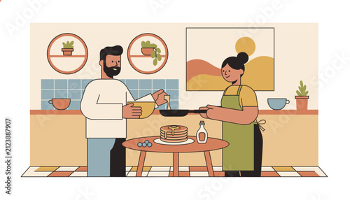 Happy couple preparing and cooking delicious pancakes together in a modern retro kitchen with warm earth tone decor.