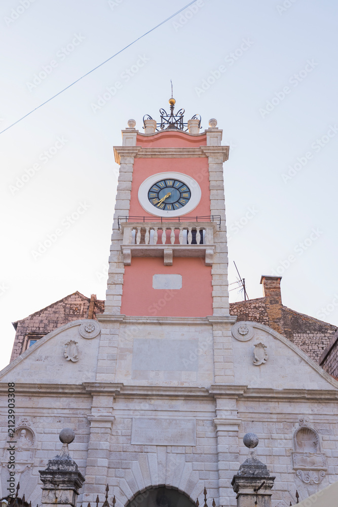 Obraz premium Historic city guard clock tower low angle view in Zadar, Croatia