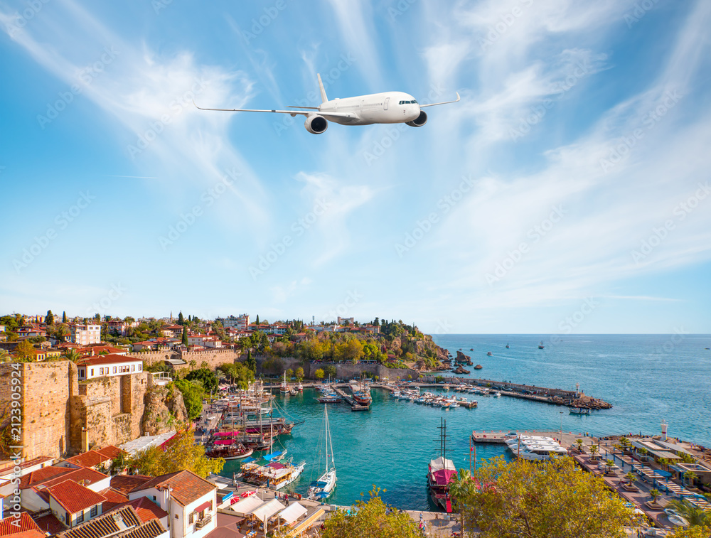 Fototapeta premium White an air plane fly over the Old Town Kaleici - Antalya, Turkey