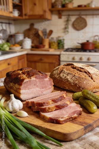Traditional Smoked Pork Fat with Rye Bread Pickles and Garlic on Rustic Wooden Board