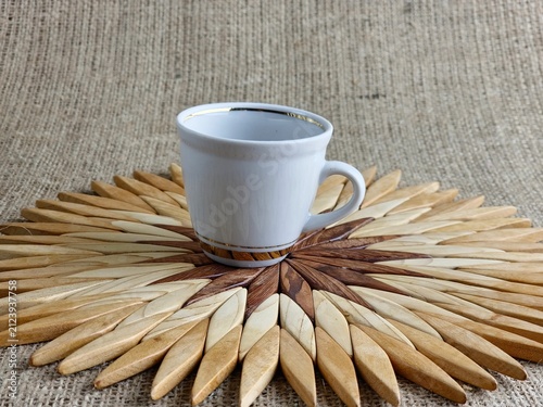 Fotografie Single Vintage Demitasse Cup on Wooden Placemat