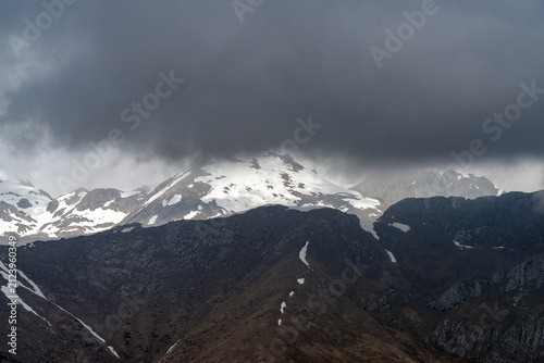 Dramatic storm clouds over Ligurian Alps mountain range, Italy
