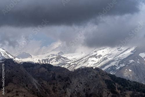 Dramatic storm clouds over Ligurian Alps mountain range, Italy