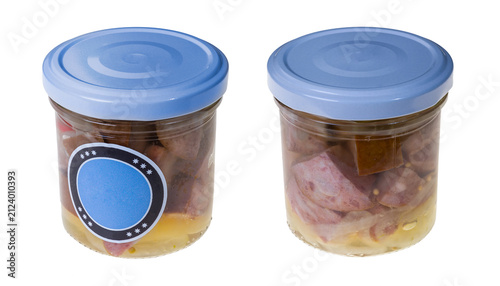 Pickled diced sausage with onion in glass jars isolated on white background. Preserved meat product of mix pork, beef and smoked bacon in spicy sweet and sour marinade. Traditional Czech cuisine food.