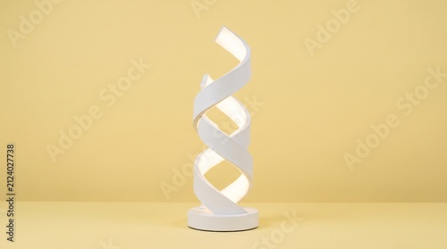 Modern white spiral LED table lamp emitting soft warm light, standing against a clean pastel yellow background.