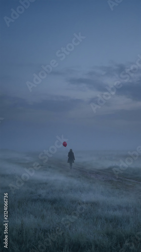 Lonely person walking in a dark foggy field holding a small bright red balloon