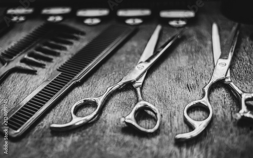 combs and scissors for haircuts lie on a shelf in the cabin