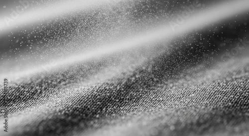 Macro view of countless tiny particles shimmering across a textured fabric surface, creating an abstract visual spectacle.