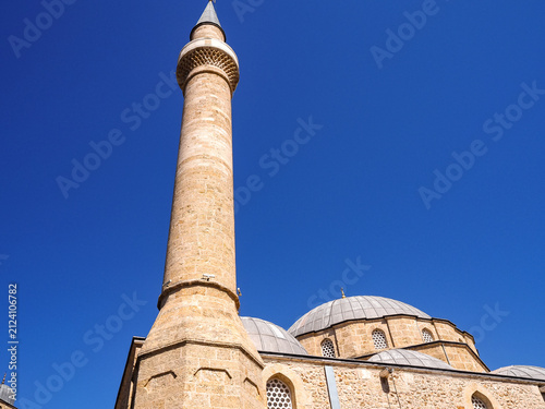 Canvas Print Mosque minaret and domes against a clear blue sky.