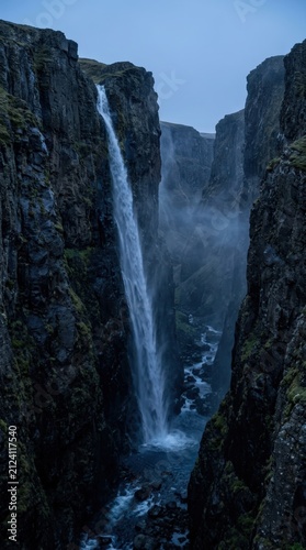 Waterfall in Deep Rocky Canyon, Dramatic Mountain Gorge with Flowing Water