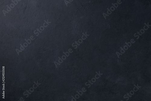 Dark black slate stone concrete texture background pattern with high resolution. Top view. Copy space.