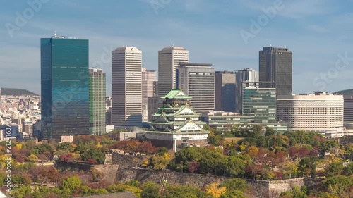 Osaka Japan time lapse city skyline at city center and Osaka Castle in autumn season