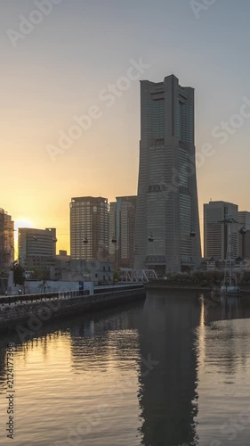 Yokohama Kanagawa Japan time lapse city skyline day to night sunset cityscape at Minato Mirai and Ooka river (vertical)