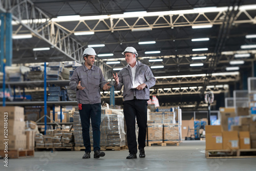 Fotografie Team of warehouse worker manage inventory, process incoming and outgoing stock,