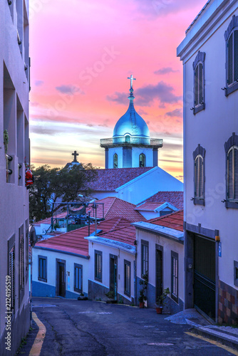Sunset in Funchal, Madeira, Portugal with Soccoro Church tower
