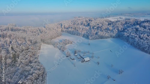 Aerial View of Pristine Snow-Covered Winter Landscape with Farmhouses