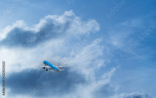 Passenger Plane Approaching Through Dramatic Sunset Sky