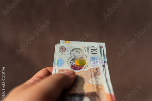 Fotografie British pound sterling GBP banknotes representing United Kingdom currency financ