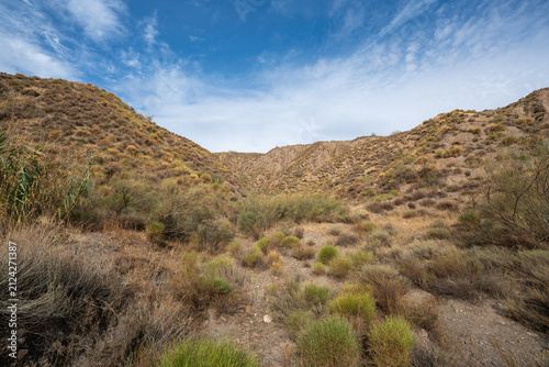 Desert Hills Under a Partly Cloudy Sky