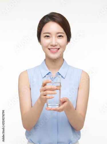 Woman Holding Glass of Water in Bright and Clean Environment