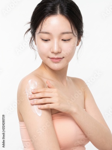 Woman Applying Moisturizer on Skin for Radiant and Healthy Look