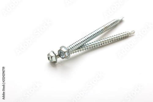 Large wall-mounting screws on a white background. Self-tapping screws for fastening boards.